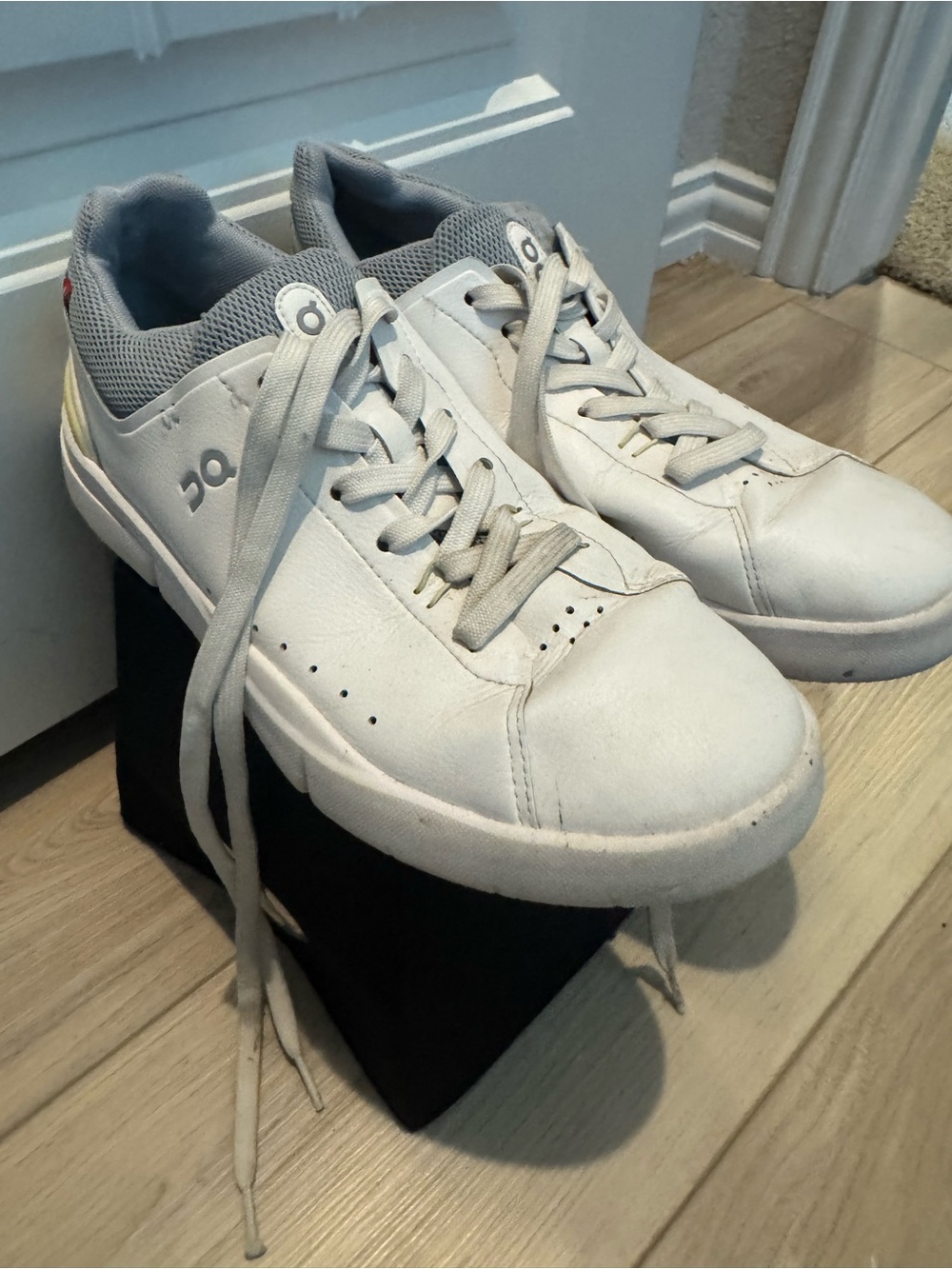 On Running White and Grey Women’s Leather Lace-Up Sneakers